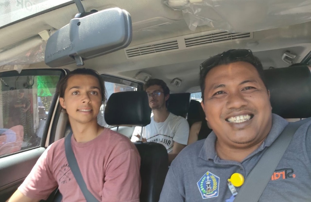 Satisfied tourists on a road trip with Wayan